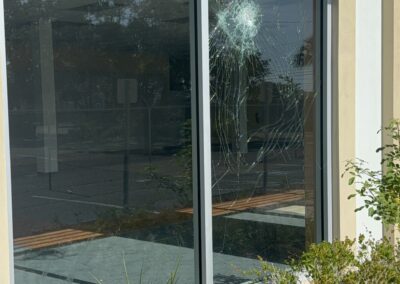 Vacant commercial storefront before professional board-up services by Southwest Removal.
