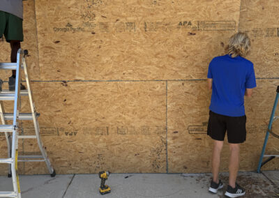 Commercial property being secured with professional board-up installation in Clearwater, Florida.