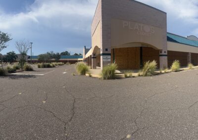 Commercial board-up services completed at a vacant shopping center in the Tampa Bay area by Southwest Removal.